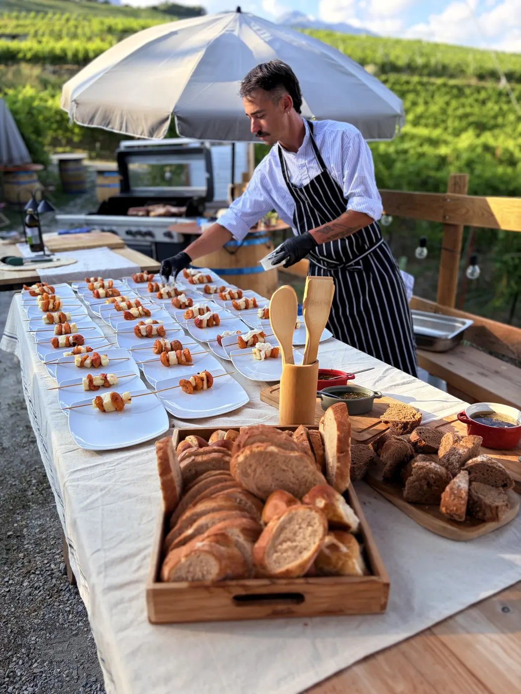 Brochettes lined up along the table under the parasol