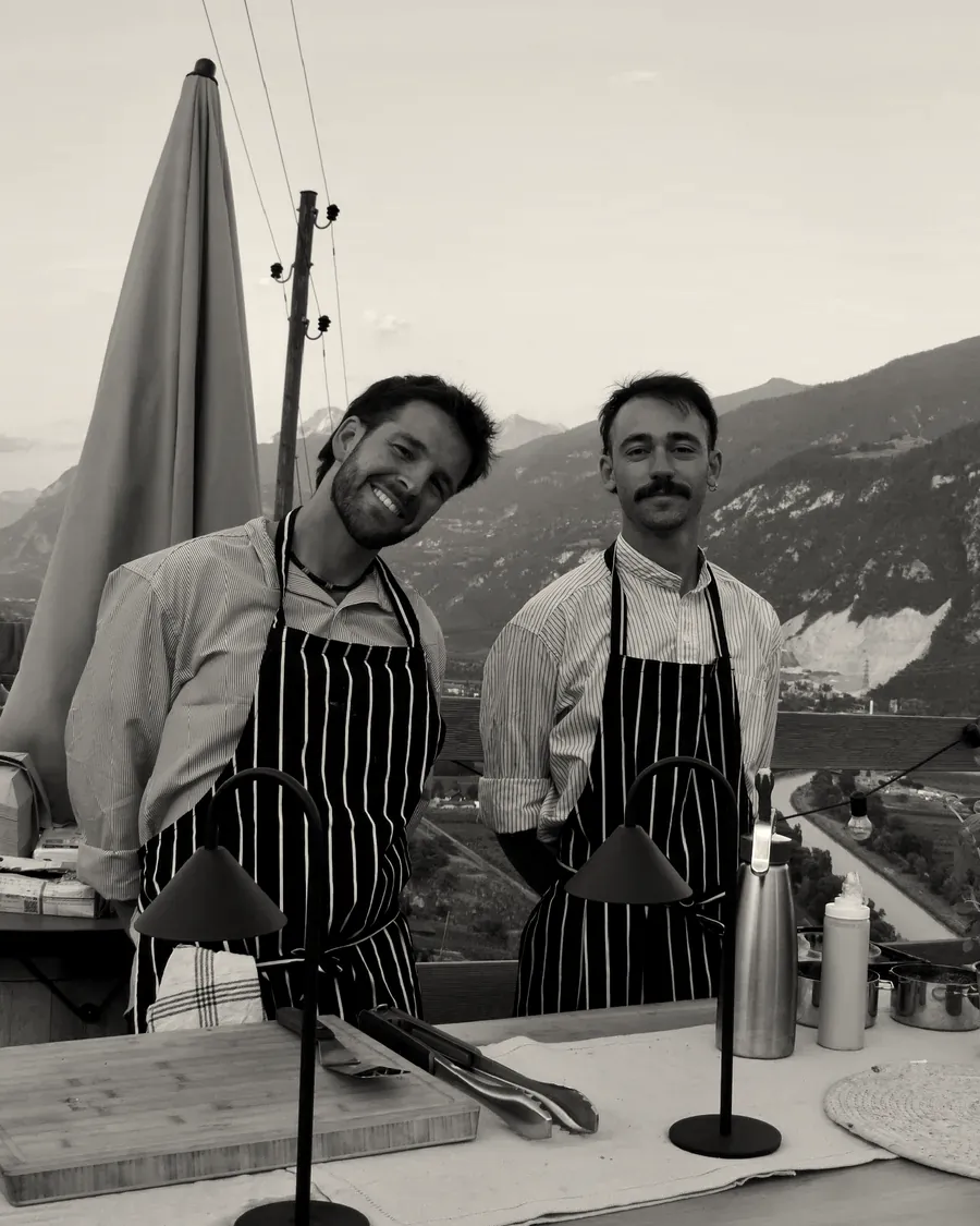 Two of the crew in striped aprons at the end of the day