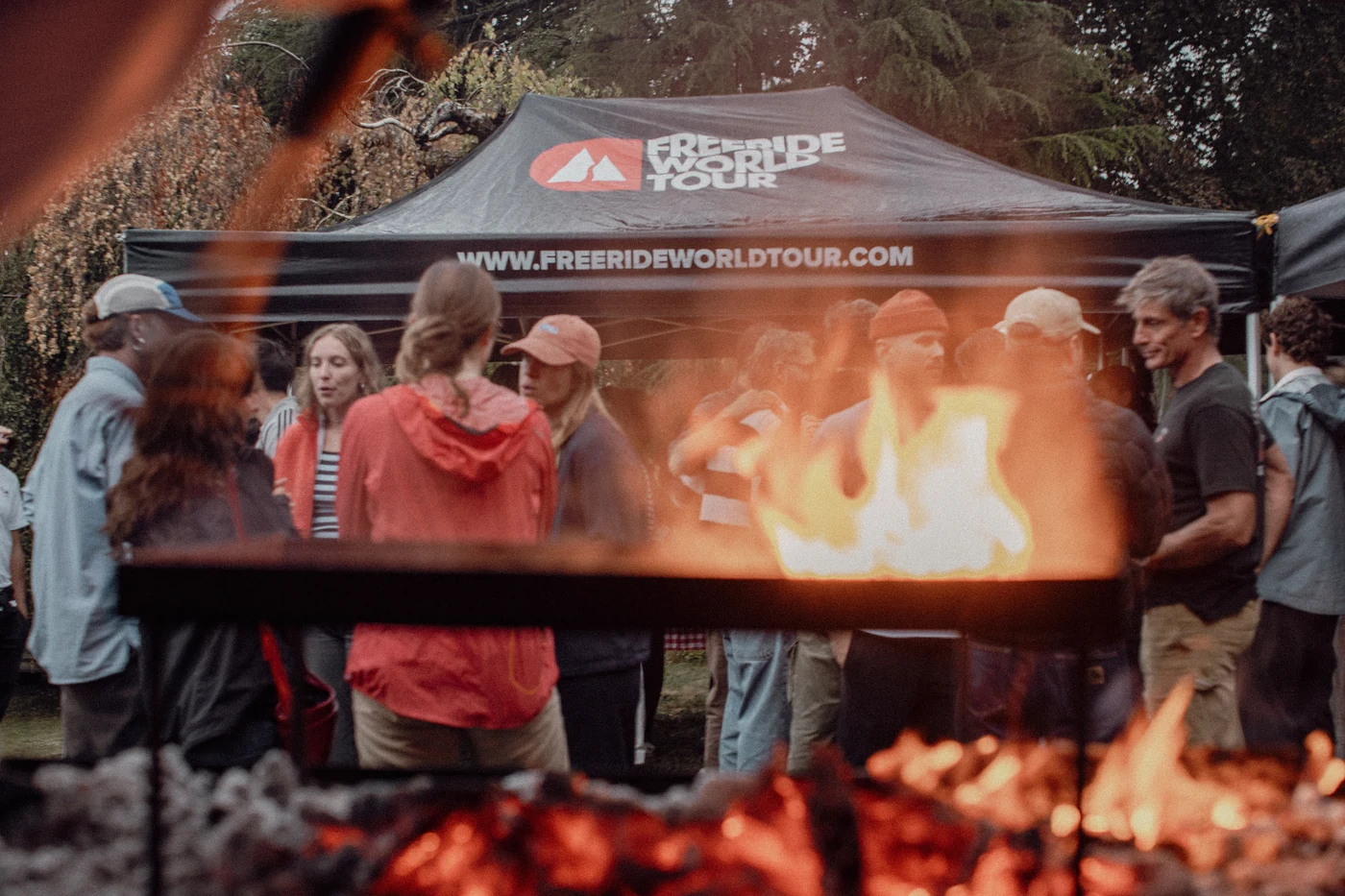 The fire in front, the Freeride World Tour tent and the guests behind it